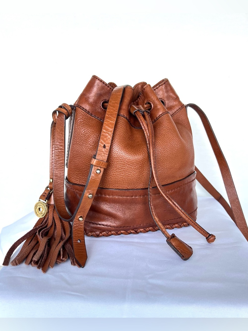 ISABELLA FLORES Cognac Pebble Leather Drawstring Charm Bucket Sml Crossbody Bag